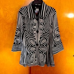 Can wear as a jacket or top, black and white.